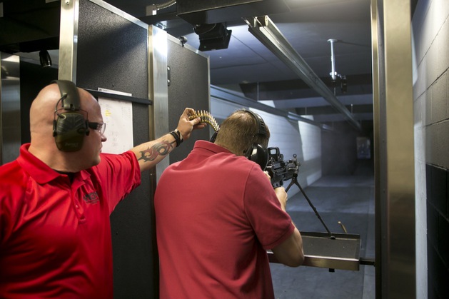 Ken Miller shoots the M249 SAW at Machine Gun Vegas, Thursday Nov 1, 2012.